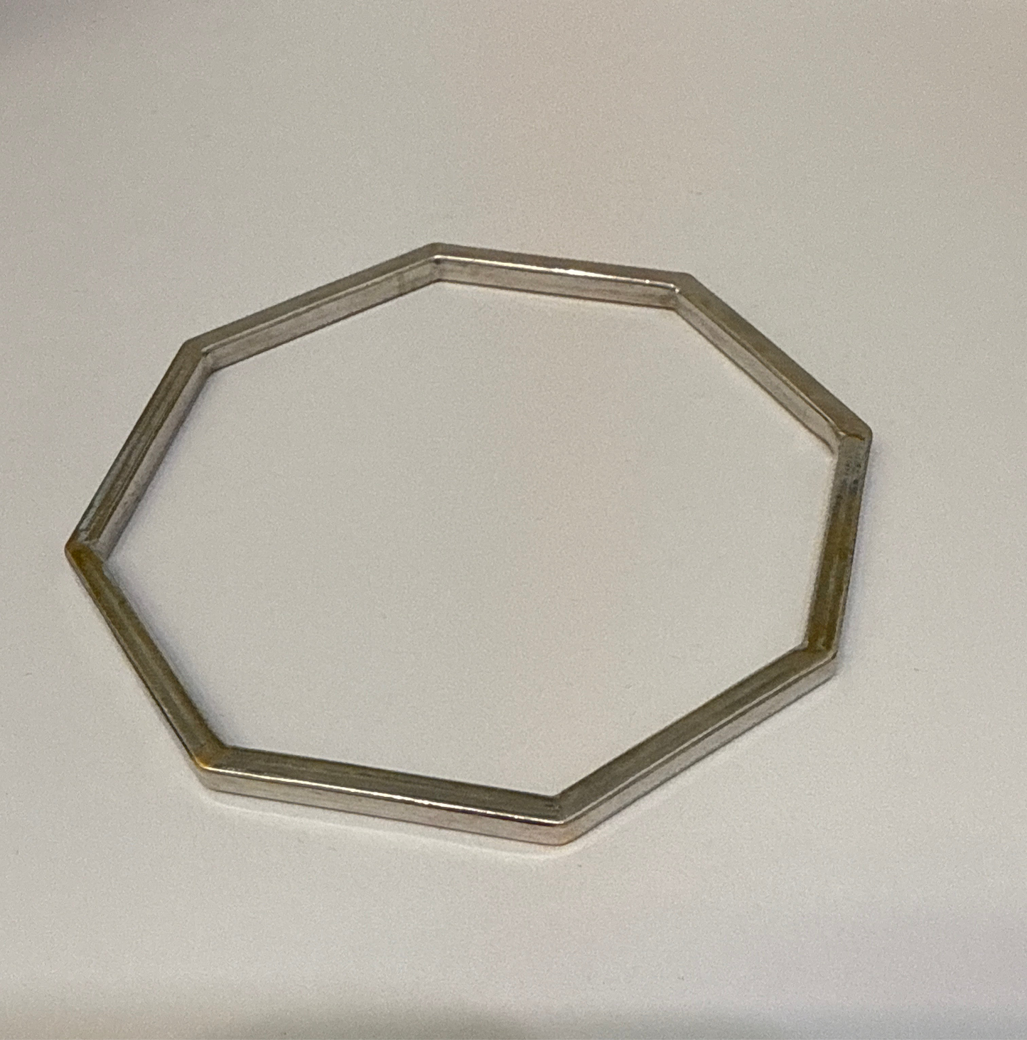One-of-a-kind Custom Design Hexagon shaped Rhodium Plated in 22K Gold Stackable Bangle. 2.10 inches - 15.3g SKU:BA014