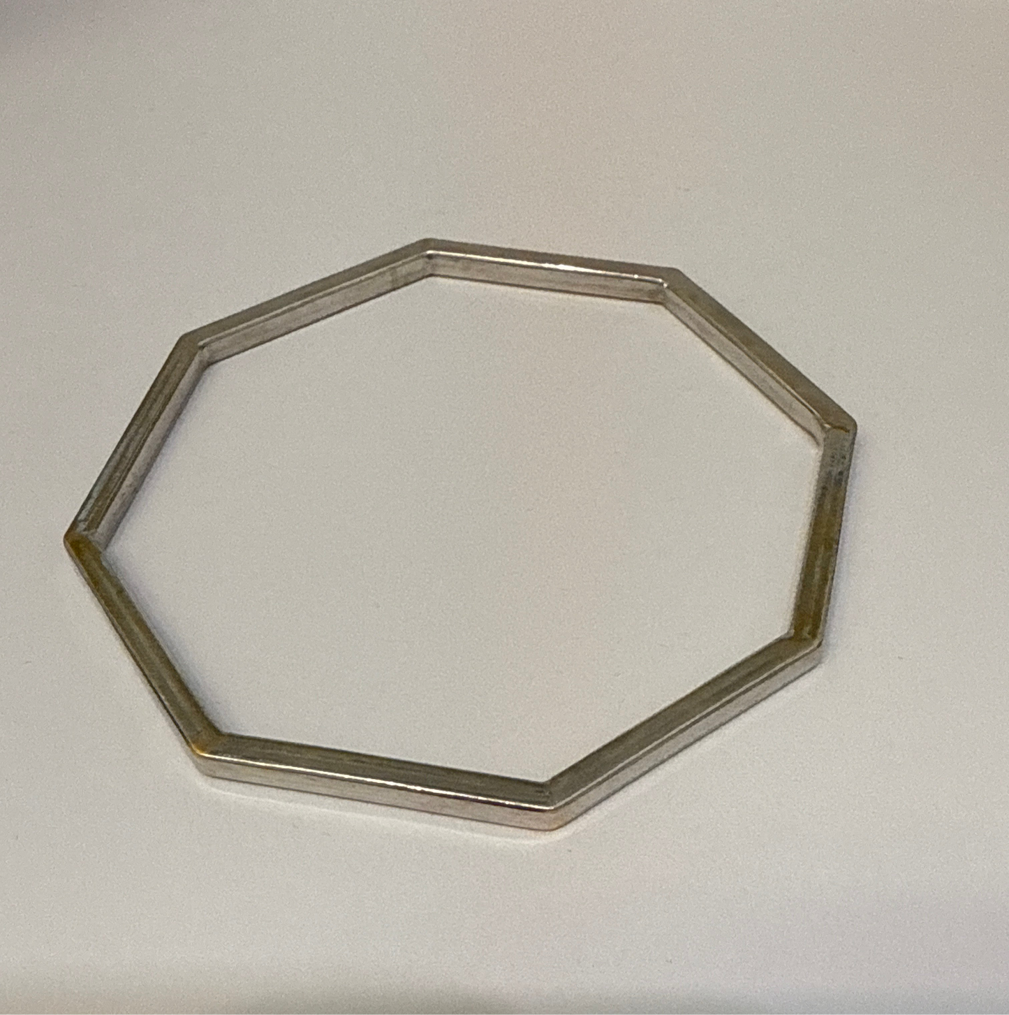 One-of-a-kind Custom Design Hexagon shaped Rhodium Plated in 22K Gold Stackable Bangle. 2.10 inches - 15.6g SKU:BA014
