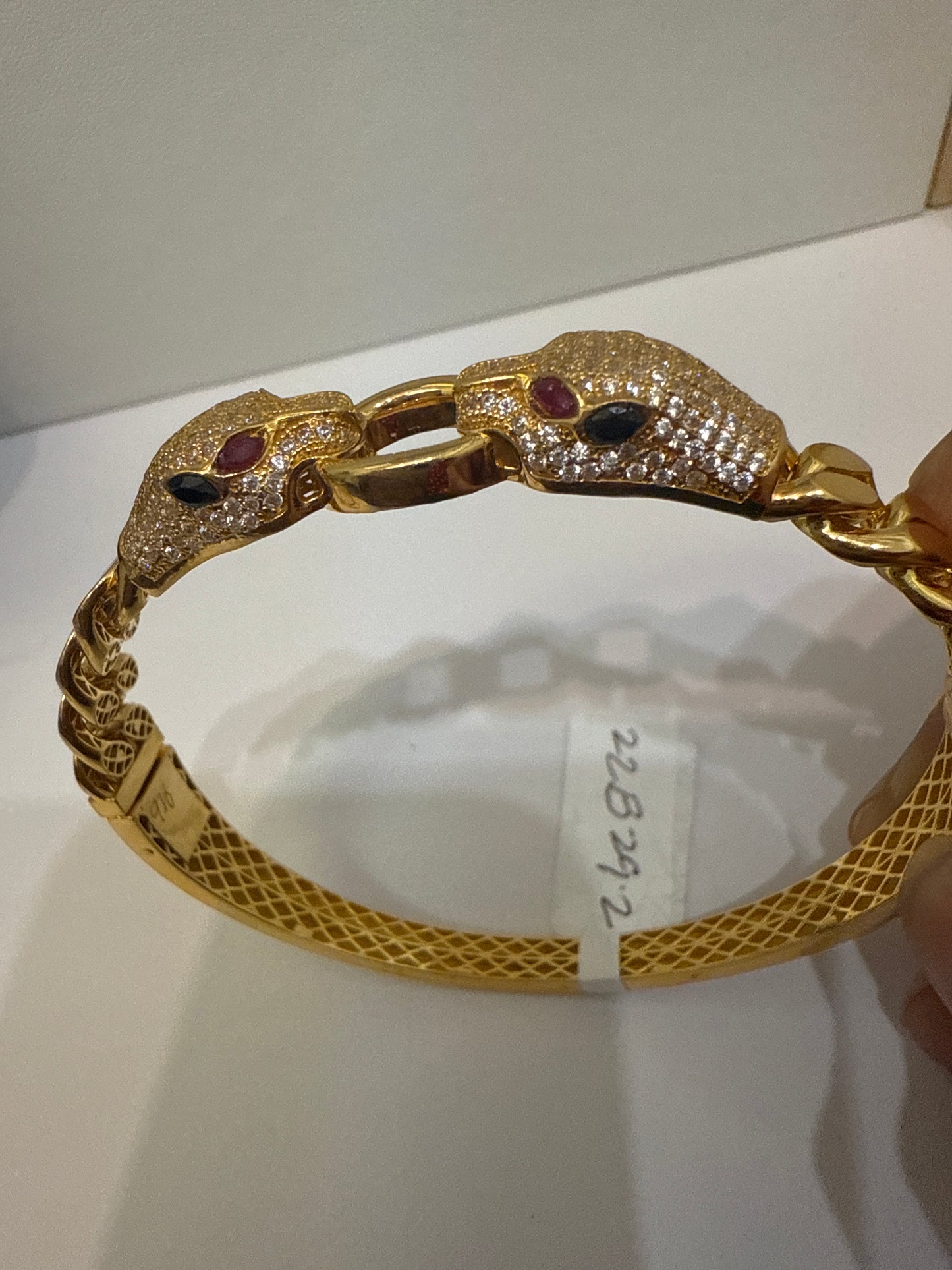 Classic Custom Design Cuff Bracelet with Two Panther Heads with a Ring with over 6 CT Ruby, Sapphire and Natural Crystals in 22K Gold. SKU: BR056